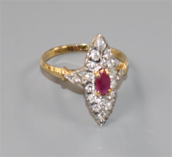 A yellow metal, ruby and diamond set marquise shaped ring, size M.